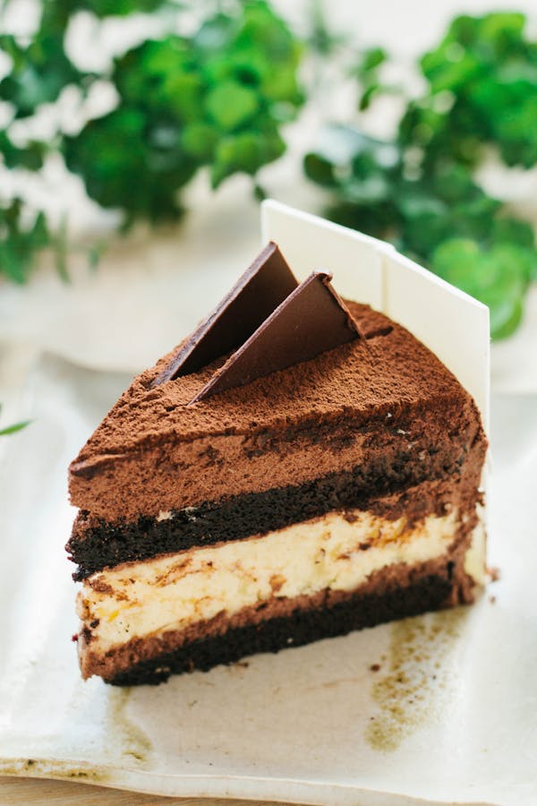 Indulge in a rich chocolate mousse cake slice, perfect for dessert lovers.